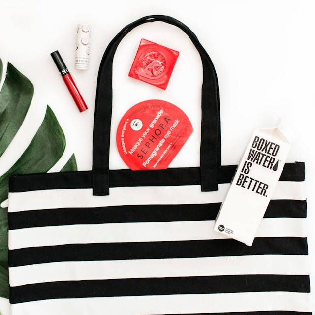 a-black-and-white-striped-handbag-with-sephora-and-boxed-water-products