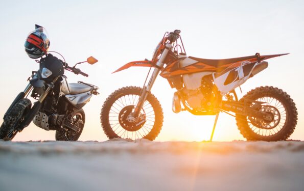 selective-focus-photography-of-two-white-and-black-dual-sport-motorcycles