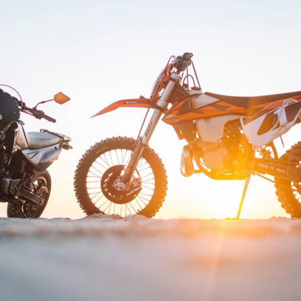 selective-focus-photography-of-two-white-and-black-dual-sport-motorcycles