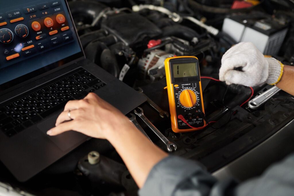 mechanic-using-multimeter