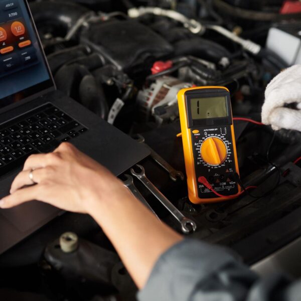 mechanic-using-multimeter
