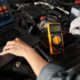 mechanic-using-multimeter
